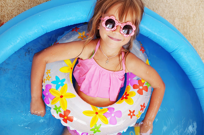 A happy child having fun in a pool