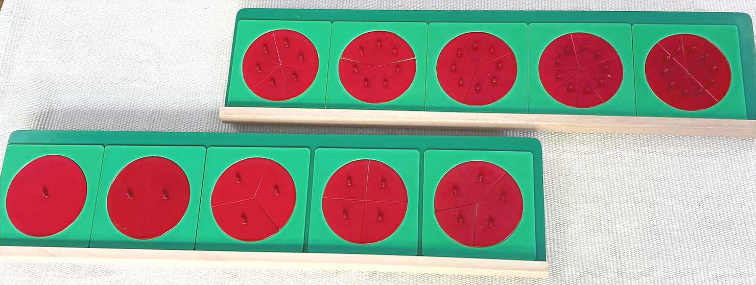 The Montessori material red and green fraction circles on a rug